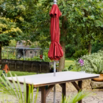 Outdoor dining table with umbrella