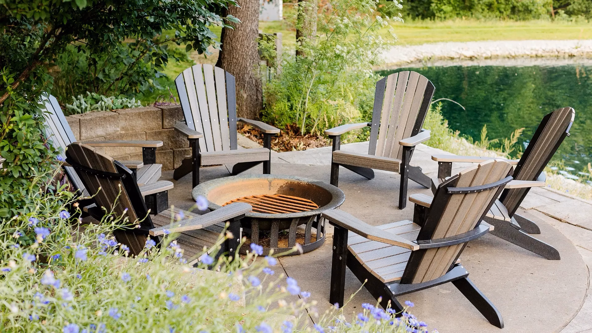Brown Timbercraft Poly Furniture Chairs in a circle around a fire pit